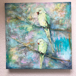 Happy Days by Sarita Keeler mixed media artwork of two London parakeet birds on branches against a beautiful colourful background on wall