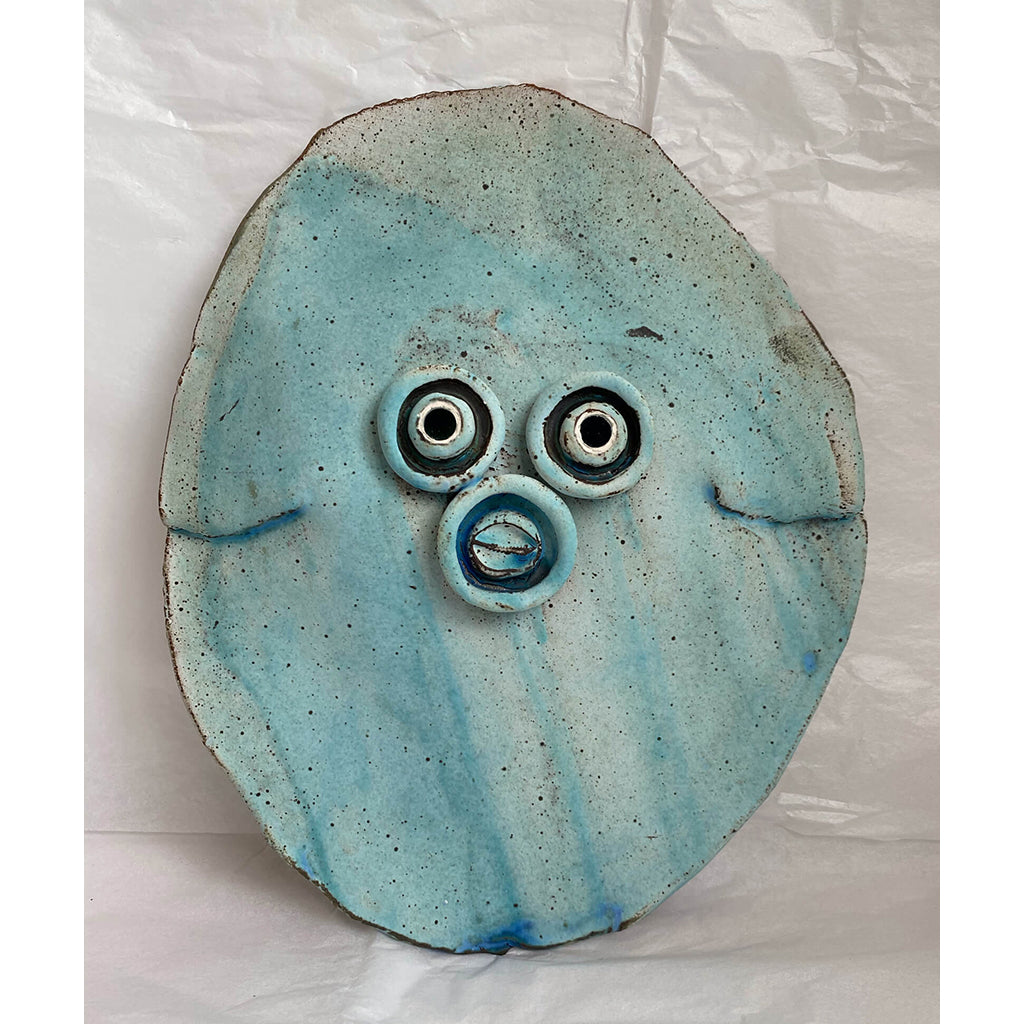 Mirror Eye Cowrie Mouth Stoneware clay wall piece with dry sky-blue glaze by Corrine Edwards South London ceramic artist