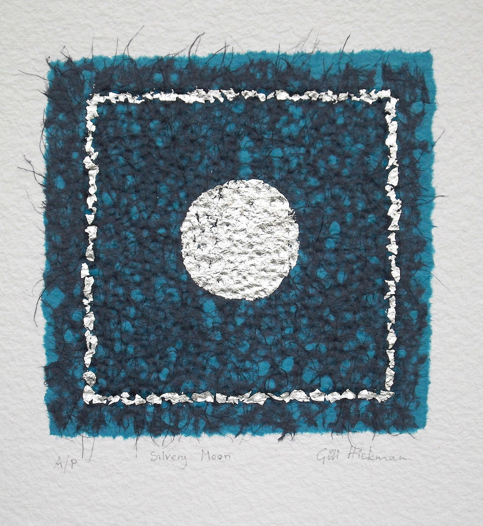 silvery moon, an original artwork by gill hickman, an embossed silver circle sits in a silver frame on a background of blue