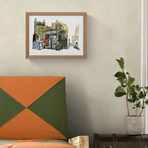 artwork depicting a colourful graffiti street scene with the words 'COPENHAGEN' and 'GRAFFITI', displayed on a light beige wall above a modern bed with an orange and green geometric pillow and a potted plant.