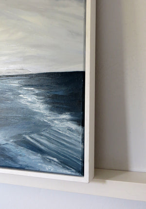 Abstract painting with wavy blue and white patterns in a white frame.