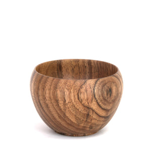 A handcrafted wooden bowl with a rich brown grain pattern, photographed on a seamless white background.
