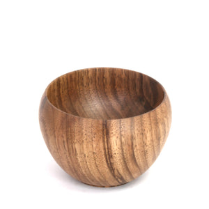 A small round wooden bowl with a rich brown wood grain pattern, photographed on a clean white background.