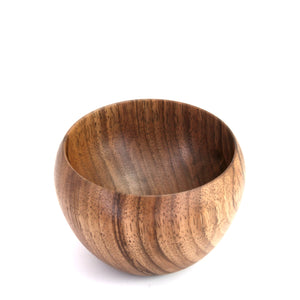 A small round wooden bowl with a rich brown wood grain pattern, photographed on a clean white background.