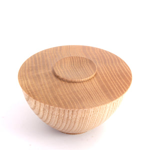 A round wooden bowl with a matching lid, featuring a prominent natural wood grain pattern, photographed on a clean white background.