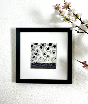 DANCING II  mixed media original artwork using monotype print with embroidery by London based artist Linda Jenkins framed and hanging on a wall