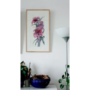 An original ink on paper artwork of purple lily flowers by artist Judy Head framed