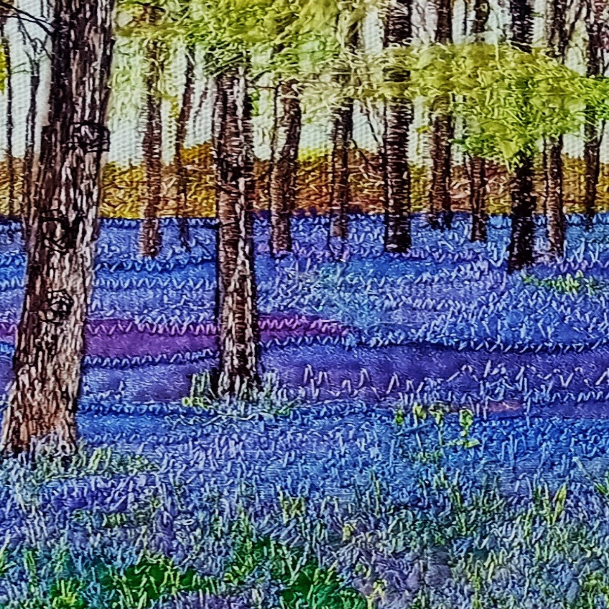 This bluebell scene captures the beauty of a spring day in the woods. Fabrics are layered and then stitched to create colour. texture and depth.