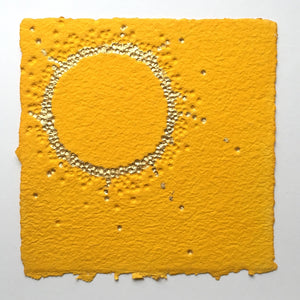 unique abstract artwork in bright yellow and gold by textural artist gill hickman, a 24k golden textured circle sits on a yellow background 