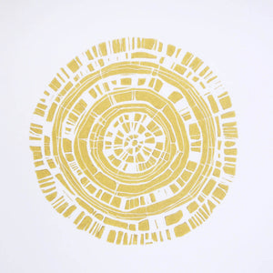 Hand printed linocut by artist Sarah Knight. Beachwood Rings is available in ochre, in an optional navy blue frame.