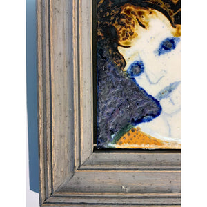 Blue Eyed Woman by mixed media figurative artist Heather Tobias oxide and glaze painted tile set in a wooden frame corner detail