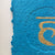 Close up of the blue section of Chakras by Gill Hickman Textural Artist, showing the  embossing effect and the gold leaf symbol