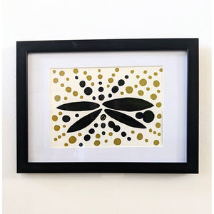 Flutter original abstract ink and acrylic A4 framed artwork in black and gold by London artist Bukola Dagiloke in frame