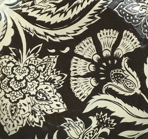 Hand decorated black stoneware plate with freehand design based on traditional Indian woodblock printed textiles by Jonquil Cook