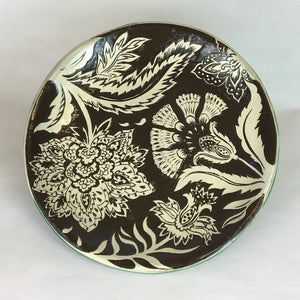 Hand decorated black stoneware plate with freehand design based on traditional Indian woodblock printed textiles by Jonquil Cook