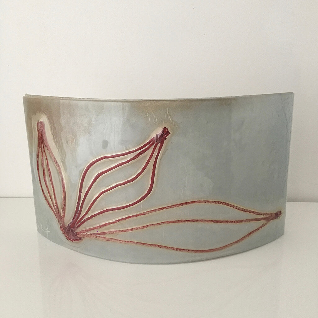 Leaves, curved by Eryka Isaak Grey Glass Sculpture with brown leaf design