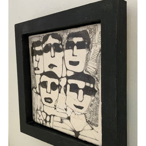 Men in Dark Glasses by Heather Tobias is a one of a kind porcelain framed handmade glazed tile comprising an original drawing side