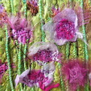 Sea View by Diana Mckinnon silk embroidery artist comprising blue sky, ocean and pink coastal flowers close up detail