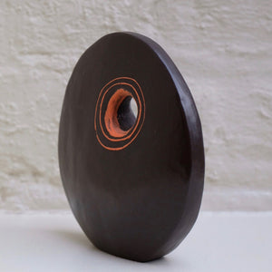 Standing Stone I by Caroline Nuttall-Smith unique hand built small black stoneware sculpture with incised orange and pale green line side orange