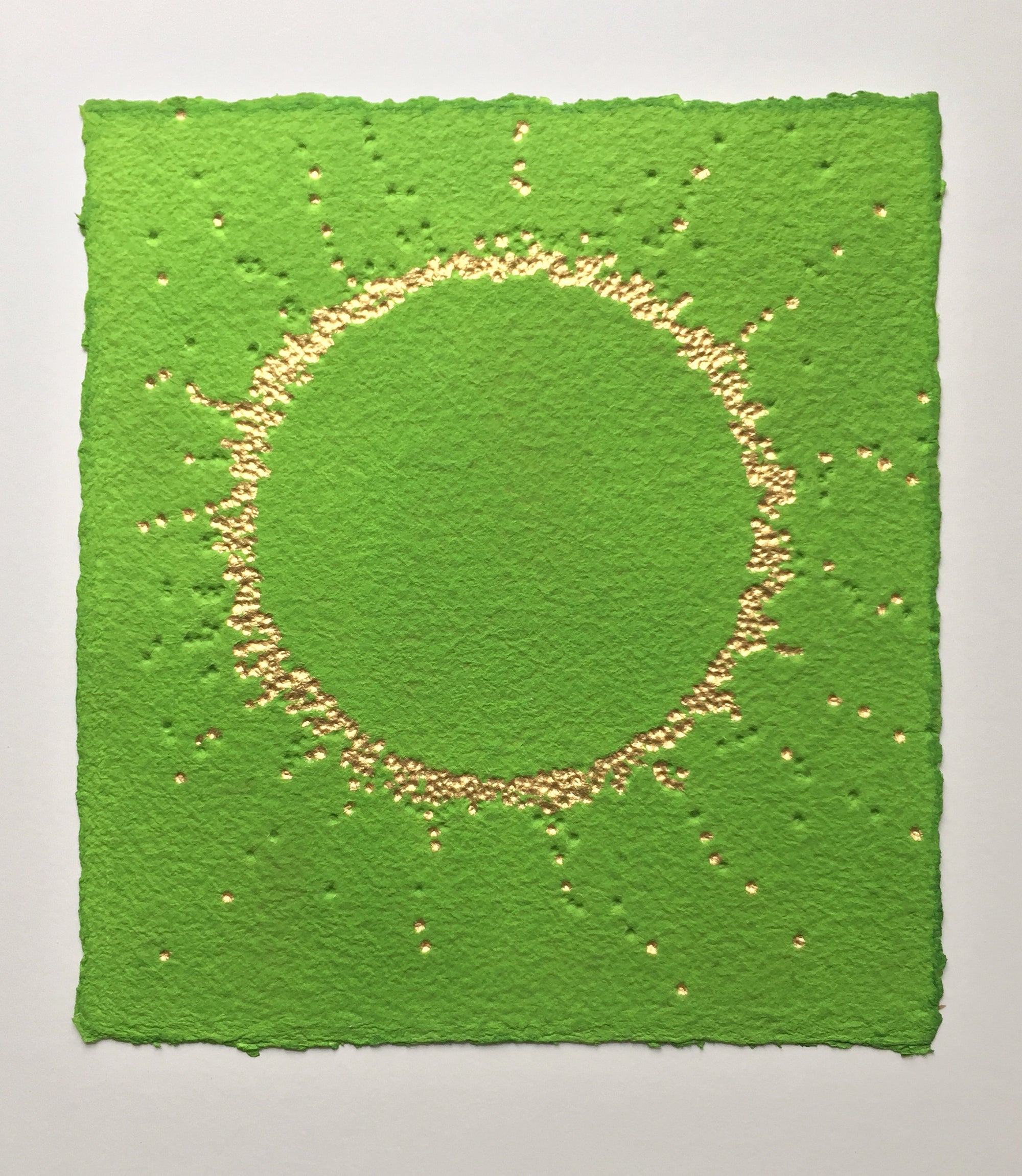 Suddenly it's spring , artwork by Gill Hickman, a deeply textured circle of gold leaf beams out from a vivid green background announcing, like a fanfare that spring has arrived. 