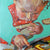 The Art of Reading by Stella Tooth is a charming original oil on canvas painting of a little girl reading a book detail
