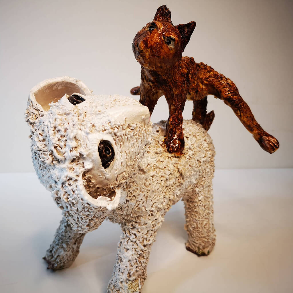 Fox Leap Frogging Over Sheep by Vivien Phelan ceramic artist.